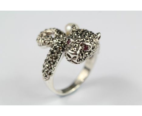 A Silver Cartier-style Ring; the ring in the form of a panther, set with a single pearl and ruby eyes, size T.