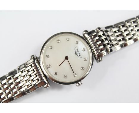 A Lady's Longines La Grand Classique Stainless Steel Bracelet Watch, the watch having a white enamel face with diamond batons