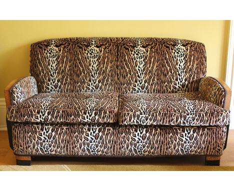 A Stunning Art Deco Walnut and Ebony Five Piece Suite, with leopard-print upholstery, comprising one sofa, two easy chairs an