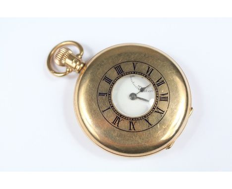 A Gentleman's 9ct Yellow Gold Half Hunter Pocket Watch. The watch having a white enamel face with Roman dial, second hand ape