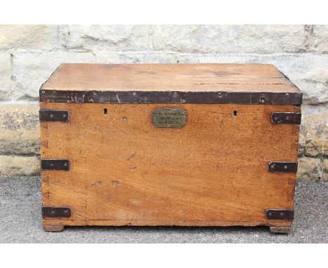 An Oak Military Trunk; the trunk has metal banding and carry handles to sides, plaque to front reads "1st Bn. Suffolk Regt. M