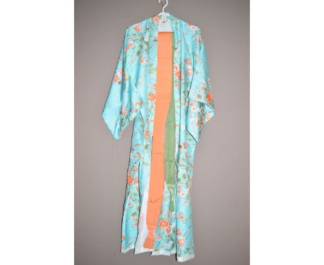 A mid 20th Century Kimono, floral decoration on blue ground; together with a green and orange sash.