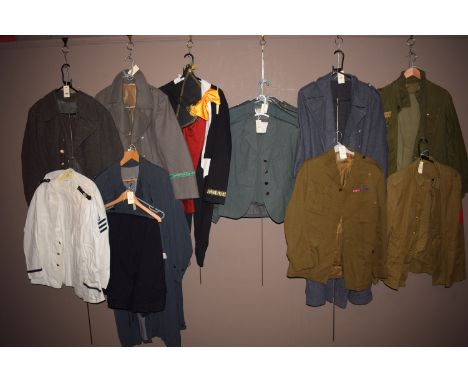 A Russian WWII woolen overcoat; an Officers Paratrooper Jacket with medal ribbons; four Womens Royal Army Corps uniforms; an 