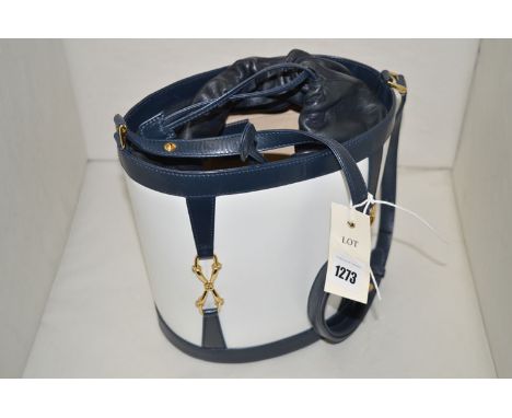 A blue and white leather hand bag, probably by Gucci, yellow metal snaffle bit design to straps, numbered 001461553, 22cms hi