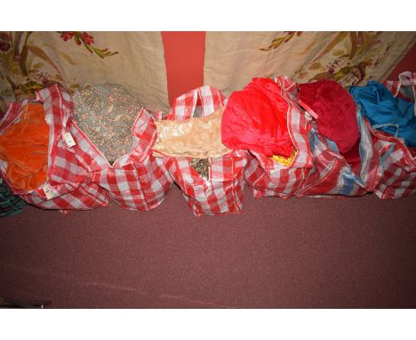 A large quantity of fabrics various; velvet curtains; etc. in nine bags.