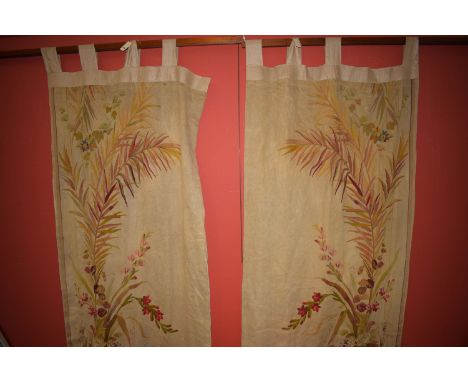 A pair of early 20th Century crewel work curtains with floral and fern decoration, 260 x 100cms (each excluding hoops).