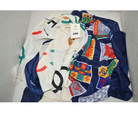 Two Chanel silk scarves, one cream ground the other navy, monogram print.  (2)