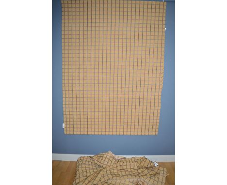 A single curtain, gold ground with check design, made for French doors, 281 x 332cms, with silk tie-back and spear-shaped cur