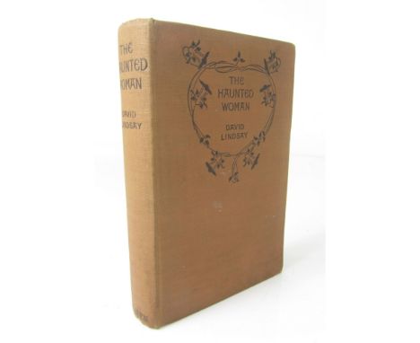 Lindsay, David  The haunted woman. London: Methuen, 1922. First edition in book form, 8vo., publisher's brown cloth, fore-edg