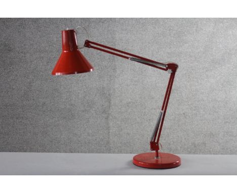 A mid-century Danish red painted anglepoise style lamp by HCF. Impressed makers mark to base. (damaged) H.84 W.20cm. 