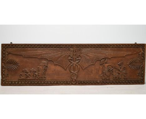 A South East Asian carved hardwood panel depicting bat wings with intertwining snakes and mythical creatures within in a carv