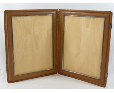 A vintage Cartier large folding pigskin leather double photograph frame, the clasps bearing French silver marks, the interior