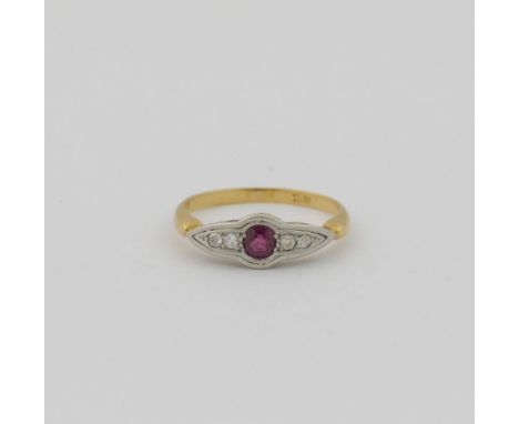 An early 20th century ruby and diamond five stone ring, the round mixed cut ruby flanked on either side by two small eight-cu