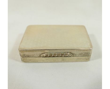 A rectangular silver pill box with gilt interior, engine turned decoration and ornate cast thumb piece, Edinburgh 1999, with 