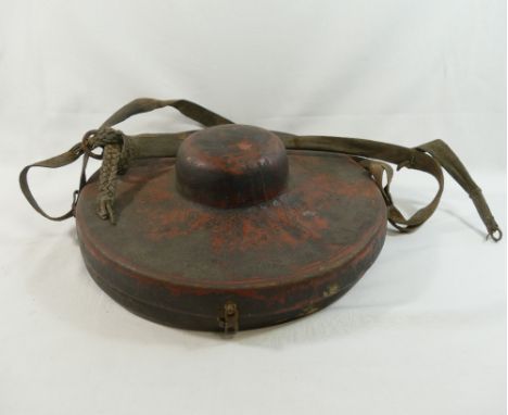 A pair of Buddhist brass cymbals, 30.5cm diameter, with leather handles, housed in red painted leather carry caseCONDITION RE