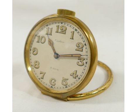 A vintage Cartier circular travel clock with 8-day movement, gold plated brass case, numbered 12186, the face with luminescen