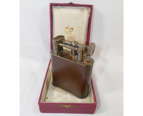 A vintage Cartier leather bound gold plated table lighter,&nbsp;11cm high,&nbsp;housed in original box CONDITION REPORTS &amp