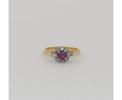 A ruby and diamond cluster ring, the round mixed cut ruby set within small baguette and round brilliant cut stones, combined 