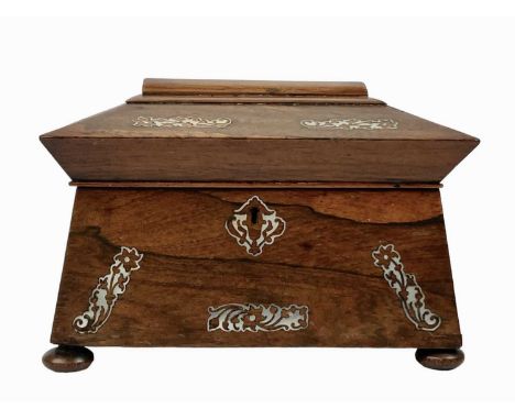 An early Victorian rosewood and mother of pearl inlaid tea caddy. Of sarcophagus shape, on disc feet, height 17cm, width 24cm