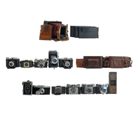 A collection of various cameras. Including, Ikon, Ikonta, Box Tengor, Zeiss leather cases, Kodak Pronto, Kodak Brownie 127, K