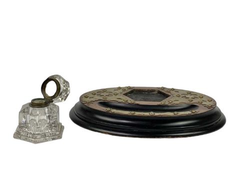 A Victorian brass mounted ebonised walnut inkstand. Fitted a hexagonal glass inkwell, width 34cm.