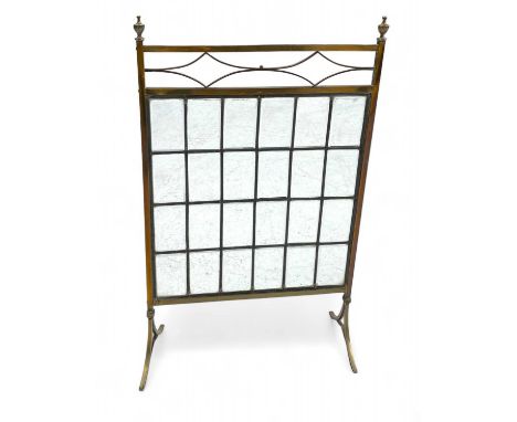 A glazed brass firescreen  With turned brass finials and leaded bevelled glass panelsMax height 84cm, width 51cm.