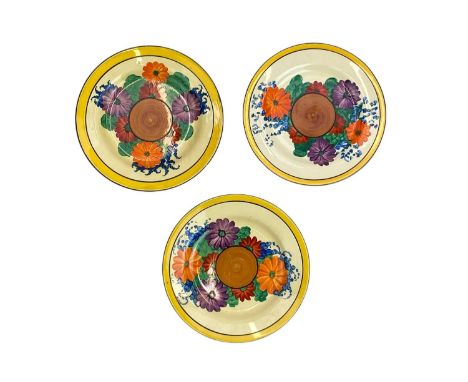 Three Clarice Cliff Gay Day pattern side plates. Newport and Wilkinson makers marks. (3)