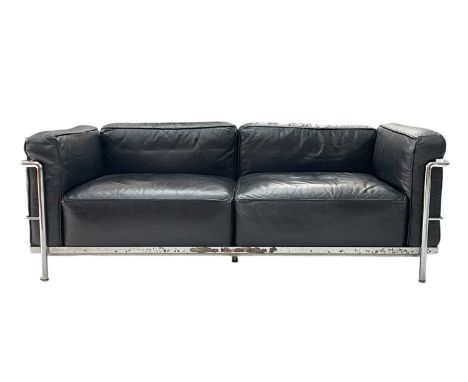 A Le Corbusier design leather and chrome two-seater sofa. With an attached Cassina label, with black leather cushions and a c