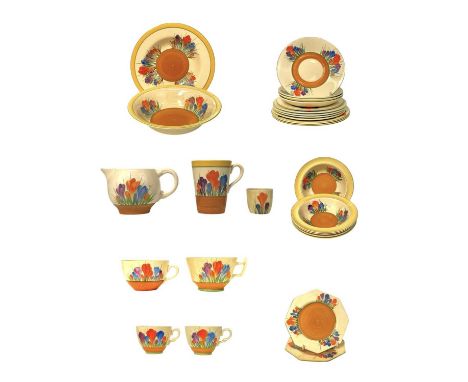 Clarice Cliff Crocus pattern. Comprising: two teacups, two breakfast cups, a mug, an egg cup, four saucers, seven side plates