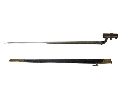 An 1876 Martini Henry socket bayonet. The fullered triangular steel blade stamped WD under broad arrow mark, E under a crown 