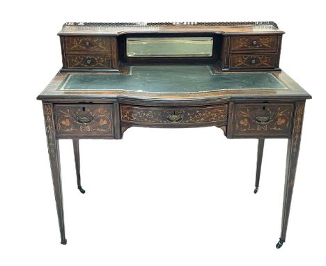 A late Victorian rosewood and inlaid marquetry Carlton House type writing desk. A raised galleried mirror back with two pairs