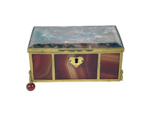 A polished moss and banded agate trinket box. 19th century, with engine turned gilt metal mounts, on ball feet, height 7.2cm,