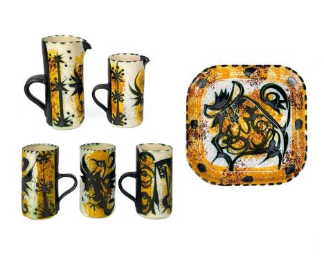 A Celtic pottery small rectangular tray. Painted with a bull, 20cm square, together with three Celtic pottery mugs, and two j