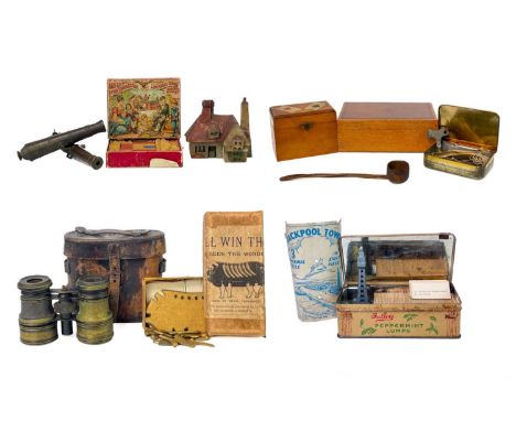 A mixed lot, including two bronze model canon. Length 15.5cm, a John Cole cast metal 'Who'll Win The Pig' game, boxed, a boxe
