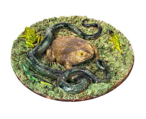 A Palissy style Portuguese Majolica dish. Late 19th century, by Jose Francisco de Sousa, modelled with a giant toad, two liza