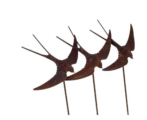 A flight of three iron swallow garden ornaments. Height 160cm.