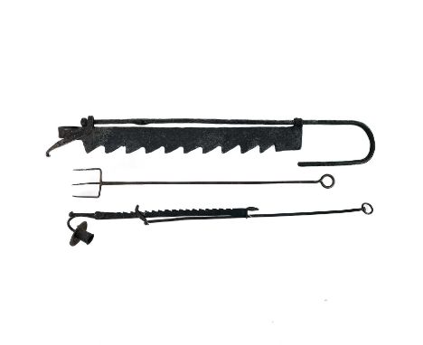 A wrought iron chimney crane. Early 19th century, length 77cm, a similar adjustable candle holder, and a toasting fork (3).