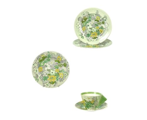 A Clarice Cliff Crepe de Chene conical cup and saucer. Bizarre Wilkinson Ltd marks together with two dinner plates and a side