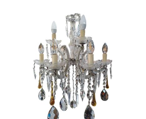 A six branch cut glass chandelier. With C scroll arms trailing drops terminating with lustres, amber glass tear shaped drops 