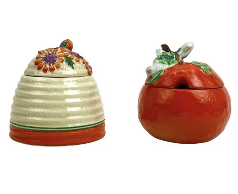 A Clarice Cliff Marguerite pattern beehive honey pot and cover. Bizarre Newport Pottery marks, height 9cm together with an Or