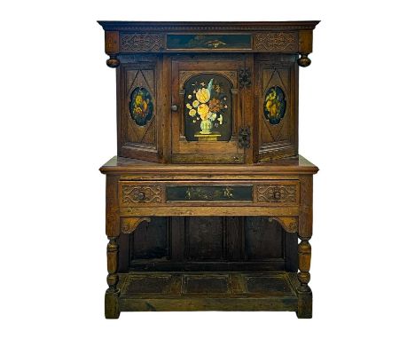 An unusual carved and painted oak side cabinet.  Circa 1920, possibly incorporating some earlier timber, the carving probably