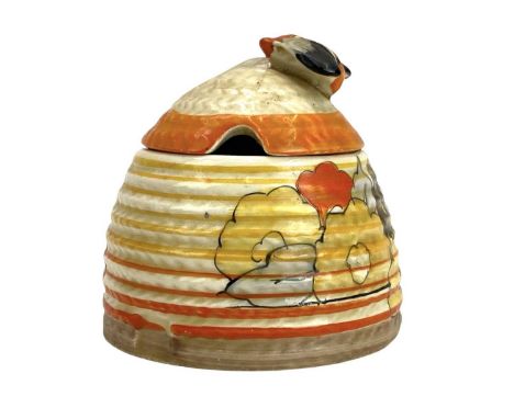 A Clarice Cliff Carpri pattern beehive honey pot and cover. Bizarre Wilkinson Ltd marks, height 7cm.