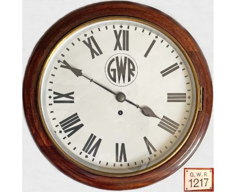 Great Western Railway 12-inch, mahogany-cased RAILWAY CLOCK with GWR roundel on the dial. Carries ivorine plate on side readi