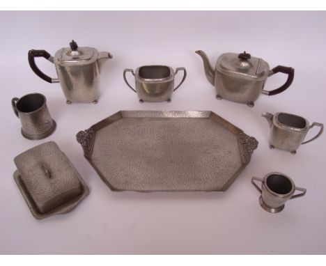 A four piece Excelsis hammered pewter tea service, a matching butter dish and cover and other similar pieces. 