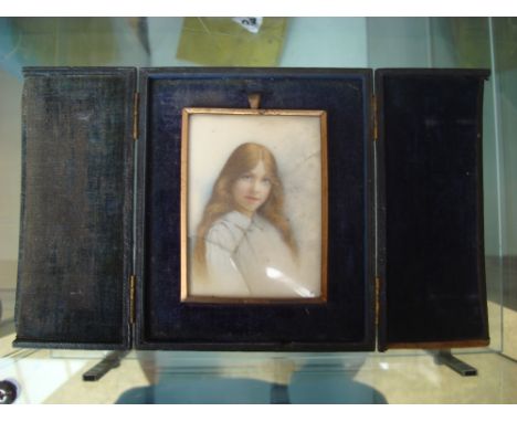 Early 20th Century British School.  Portrait miniature of a young girl, watercolour on ivory, unsigned, in fitted leather cas