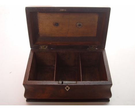 An early George III mahogany bombe shaped tea caddy, the concave moulded hinged lid with brass carrying handle opening to rev