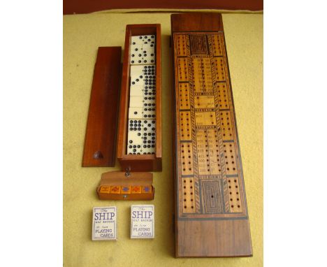 An inlaid cribbage board and a cased set of double nine ivorine dominoes. 