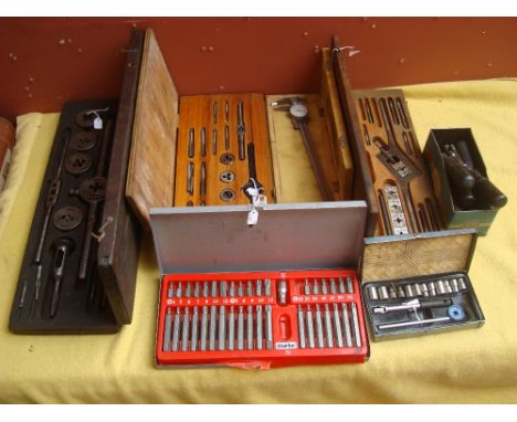 A small collection of engineers tools to include cased sets of taps and dies, socket sets, assorted box spanners, micrometer,