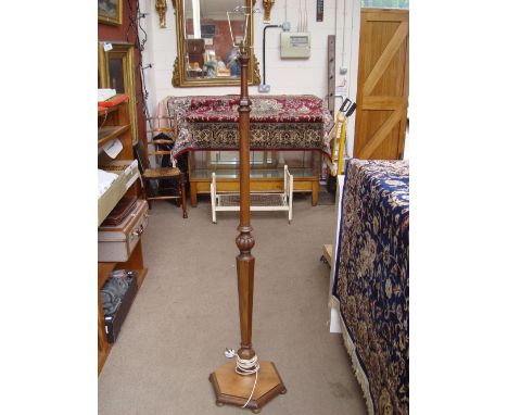 A mahogany standard lamp. 