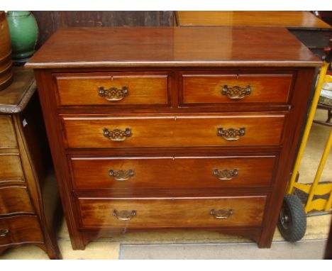 An Edwardian mahogany chest of drawers with two short drawers over three graduated long with brass handles, on bracket feet.